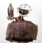 A wrought-metal mirror, a lustre fire companion set in the form of a knight, and a fur coat.