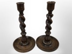 A pair of oak barleytwist candlesticks,