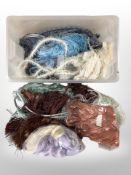 A large quantity of tasselled curtain tiebacks in various colours.