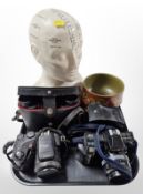 A reproduction ceramic L N Fowler phrenology bust, Minolta camera and flash, Fujifilm camera,
