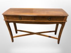A reproduction yew wood hall table,