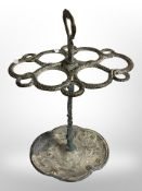 A cast-brass umbrella stand in the form of coiled snakes, height 62cm.