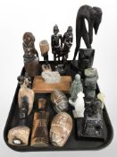 A group of African carved wooden and hardstone ornaments, Inuit soapstone carving, etc.