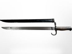 A Japanese Type 30 Arisaka bayonet with Tokyo Arsenal mark, with steel scabbard, blade 39.5cm.