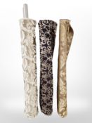 Three rolls of upholsterer's fabric / material, width approximately 140 cm, length unknown.