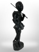 An African carved and painted wooden figure of a boy, height 92cm.