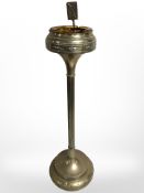 An embossed brass smoker's stand,
