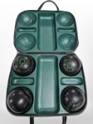 A set of four Clubmaster lawn bowls in carry case.