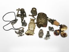 A group of cast-metal owl ornaments, enamelled examples, etc., tallest 7.5cm.