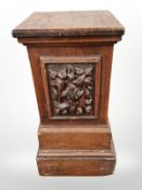 A Victorian carved oak pedestal,