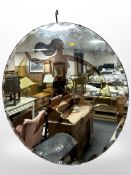 An Art Deco frameless multi-tone mirror depicting a nude female, diameter 70cm.