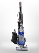 A Dyson DC25 upright vacuum cleaner.