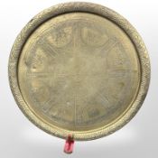 An Egyptian Revival engraved brass charger, diameter 59 cm,