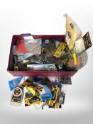 A box containing a large quantity of new fishing equipment including hooks and lines, dropshot kit,