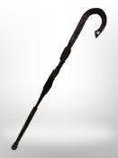 An African carved figural walking stick.
