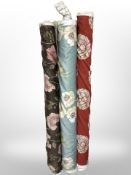 Three rolls of upholsterer's fabric / material, width approximately 140 cm, length unknown.