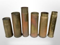 Six brass shell cases, height 35cm.