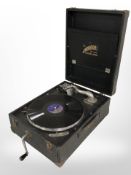 A Windsor De Luxe portable record player.