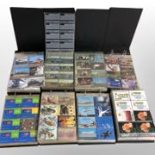 Eight albums containing a large quantity of telephone cards.