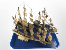 Three polished horn models of ships,