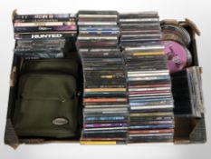 A quantity of CD's and DVD's and a small satchel (1 box)