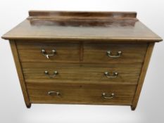 An Edwardian mahogany chest of four drawers,