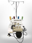 A Toyota differential feed electric sewing machine with lead and foot pedal