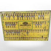 A Romac enamelled metal ignition keys board containing various keys, width 51cm.