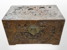 An oriental carved camphor wood table box, width 30cm.
