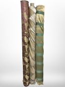 Three rolls of upholsterer's fabric / material, width approximately 140 cm, length unknown.