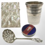 A silver tot in the form of a thimble 