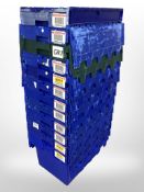 Twelve stackable plastic storage boxes with folding lids,