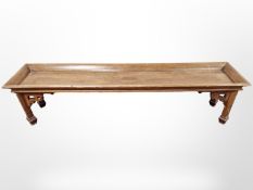 A reproduction mahogany low plant stand in the Chinese Chippendale style,