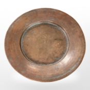 A 19th-century copper shallow dish, diameter 48cm.