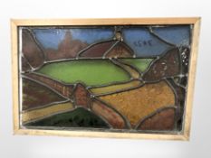 A stained leaded glass window in pine frame,