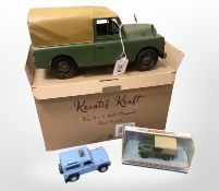 A metal hand painted model of a Land Rover Defender,