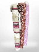 Three rolls of upholsterer's fabric / material, width approximately 140 cm, length unknown.