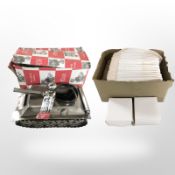 A metal bottle stand in the form of a tank together with a large quantity of flat packed boxes 11