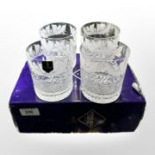 A set of four Edinburgh Crystal whisky tumblers etched with thistles, height 9.5cm, boxed.