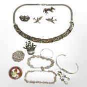 A collection of silver jewellery including pair of aeroplane cuff links, panelled necklace, bangles,