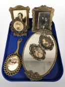 A group of ornate brass picture frames,