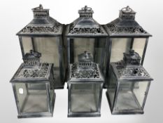 Six contemporary metal and glass lanterns, largest 40cm high.