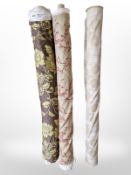 Three rolls of upholsterer's fabric / material, width approximately 140 cm, length unknown.