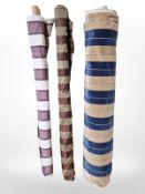 Three rolls of upholsterer's fabric / material, width approximately 140 cm, length unknown.