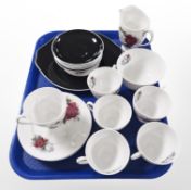 21 pieces of Queen Anne tea china decorated with roses.