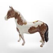 A Beswick Piebald horse, height 16.5cm.