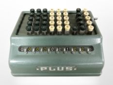 A Plus enamelled metal adding machine.