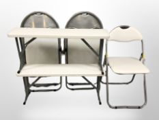 Three folding metal chairs and two similar benches