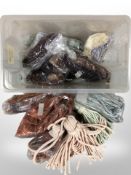 A large quantity of tasselled curtain tiebacks in various colours.