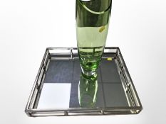A chrome and mirrored square serving tray, width 43cm, together with a green glass vase.